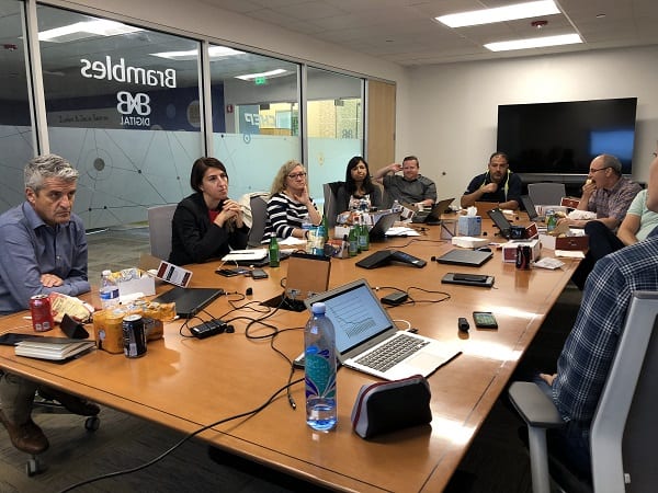 Company executives hold a meeting in a boardroom.
