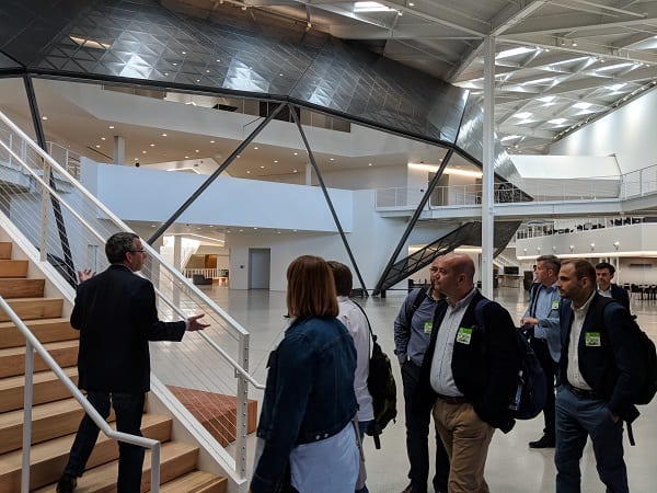 Executives from Volkswagen Bank Poland tour the offices of NVidia.