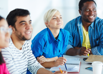 Diverse group of adults engaged in collaborative learning.